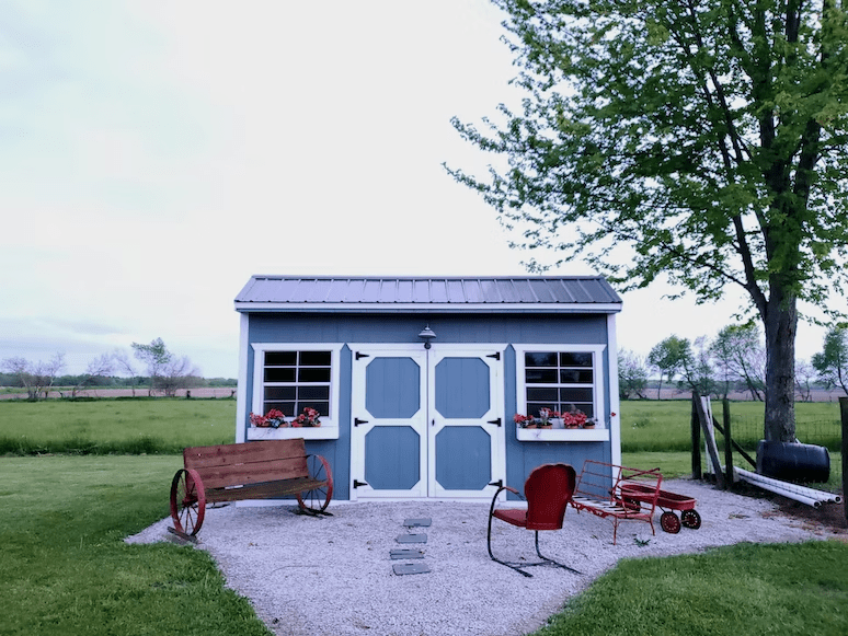 A garden shed with garden furniture
